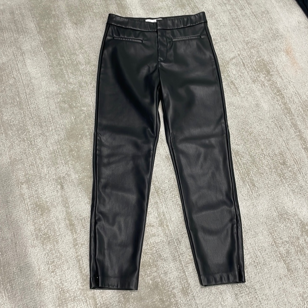 Black faux leather Zara girls pants with zipper at ankles, size 10